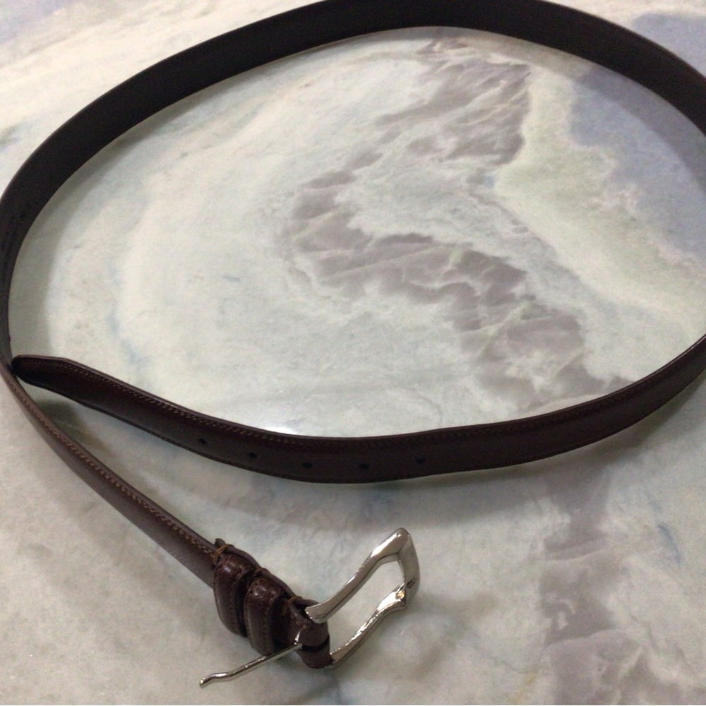Brown Leather belt. Silver buckle. Size 56. Excellent condition.